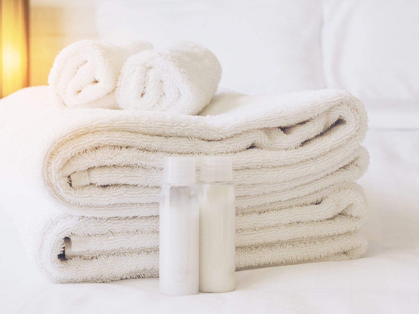 Folded white towels and hospitality supplies for your property
